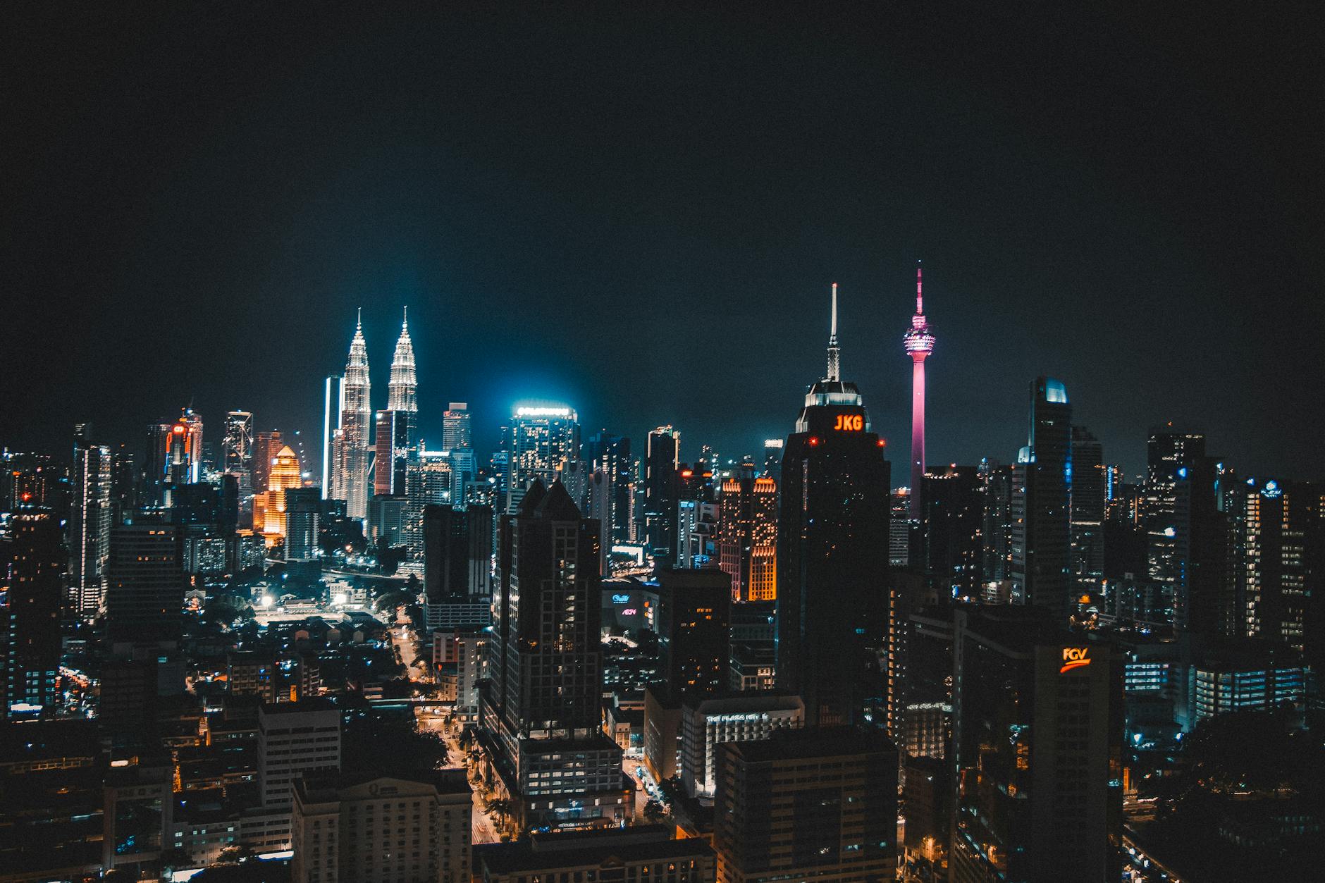 photo of high rise buildings at nighttime